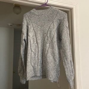 Brand new sweater with tags still on. Never worn. It has sparkle thread.